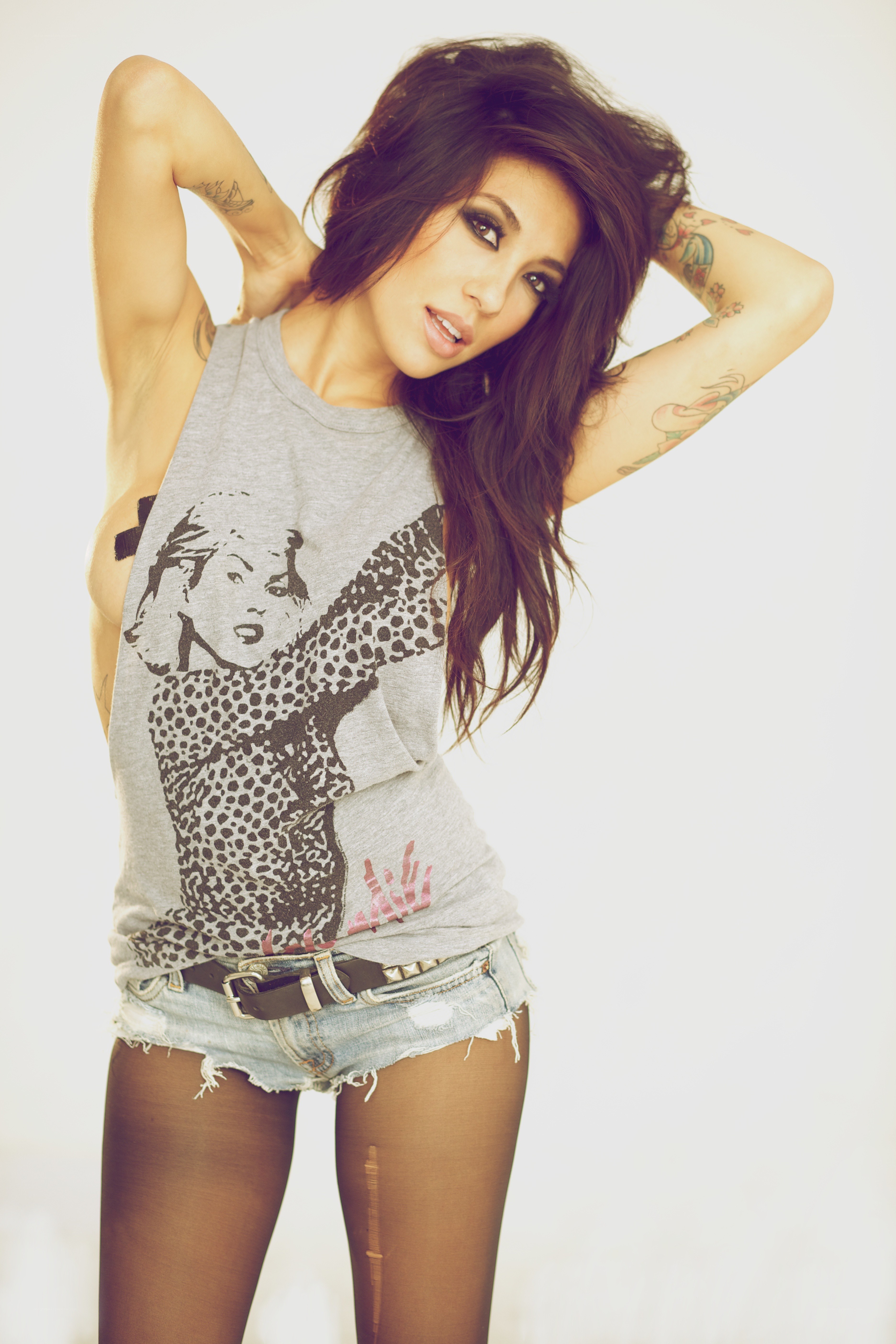 woman with tattoos posing