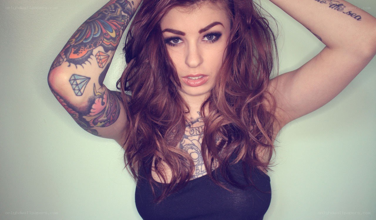 woman with tattoos posing