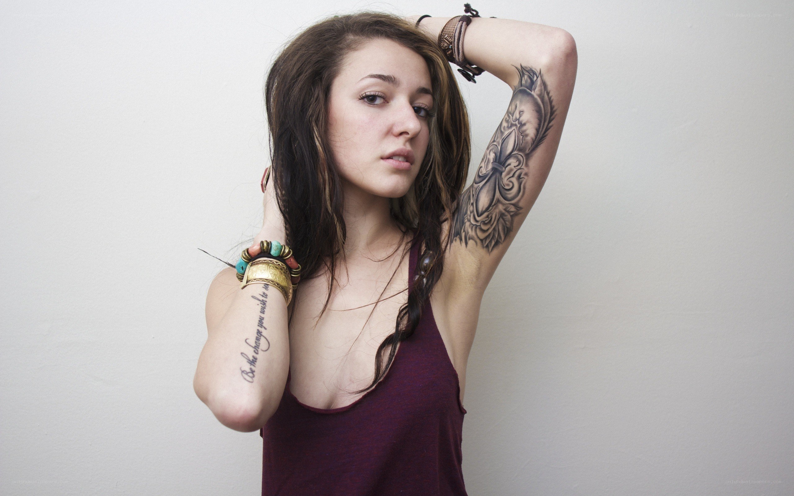 woman with tattoos posing