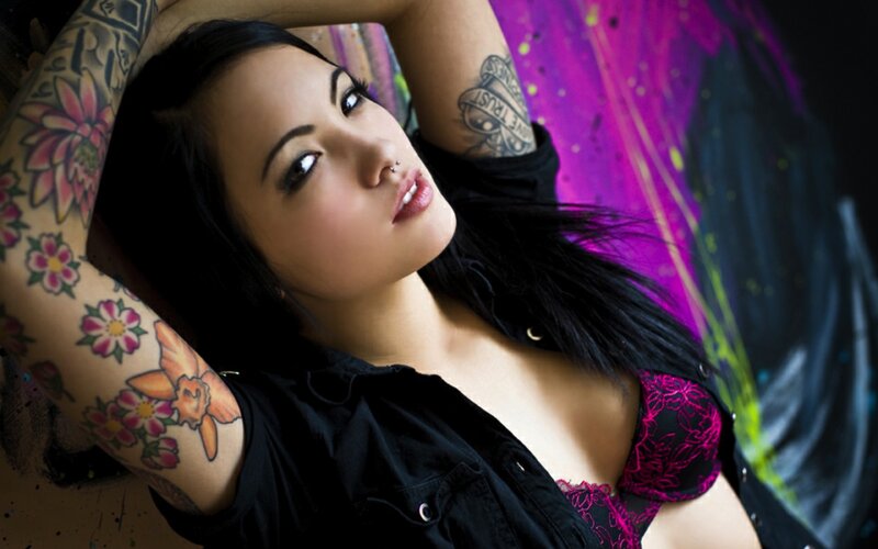 woman with tattoos posing