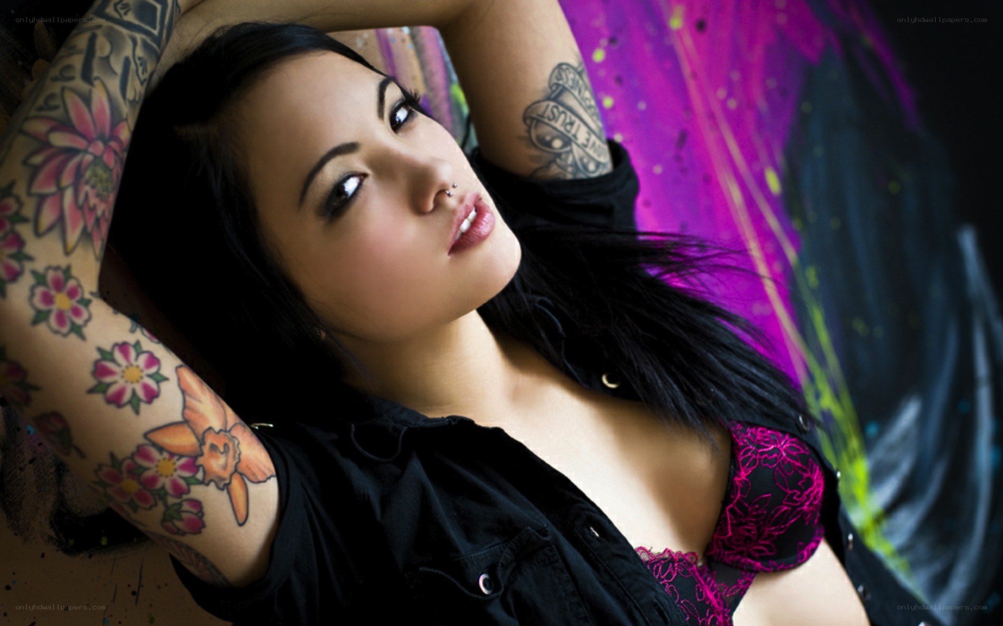 woman with tattoos posing