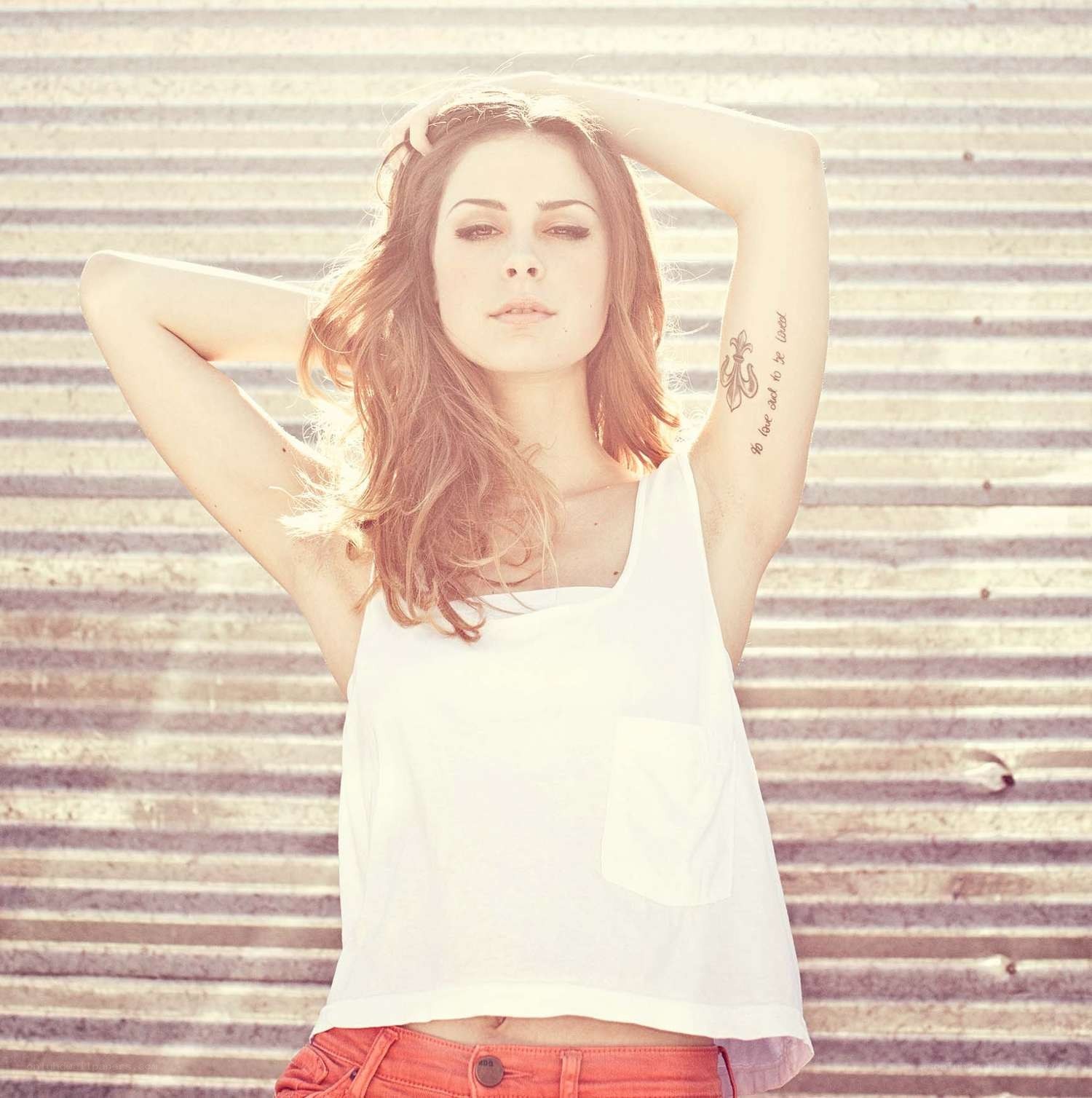 woman with tattoos posing