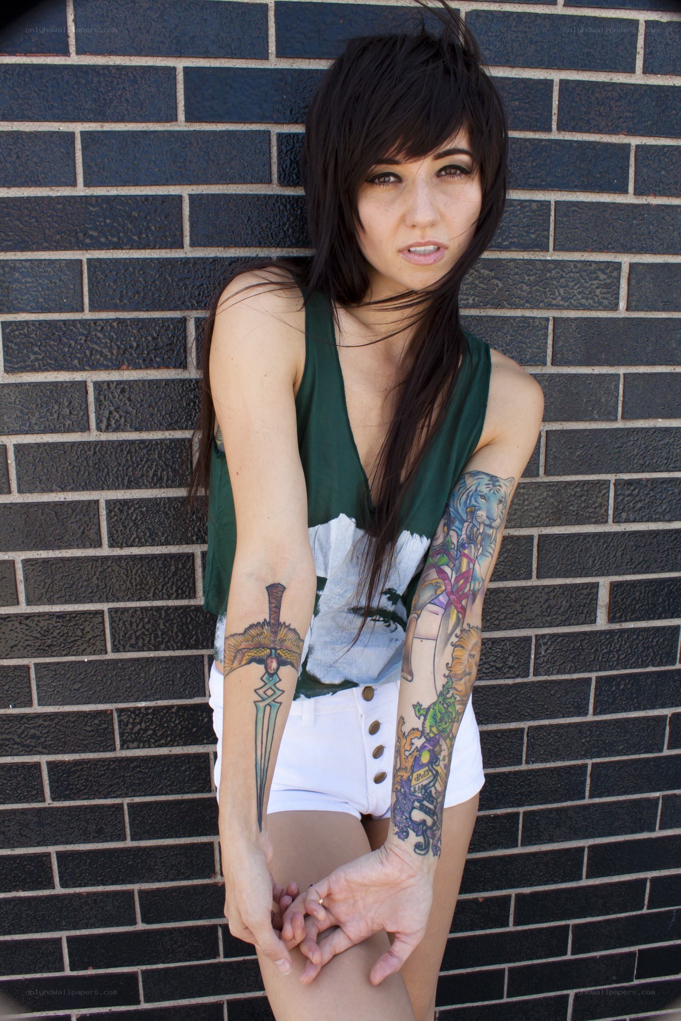woman with tattoos posing