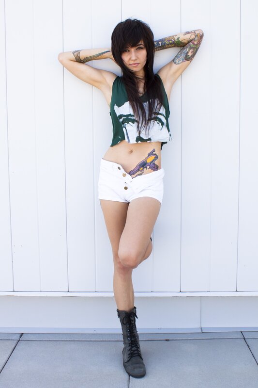 woman with tattoos posing