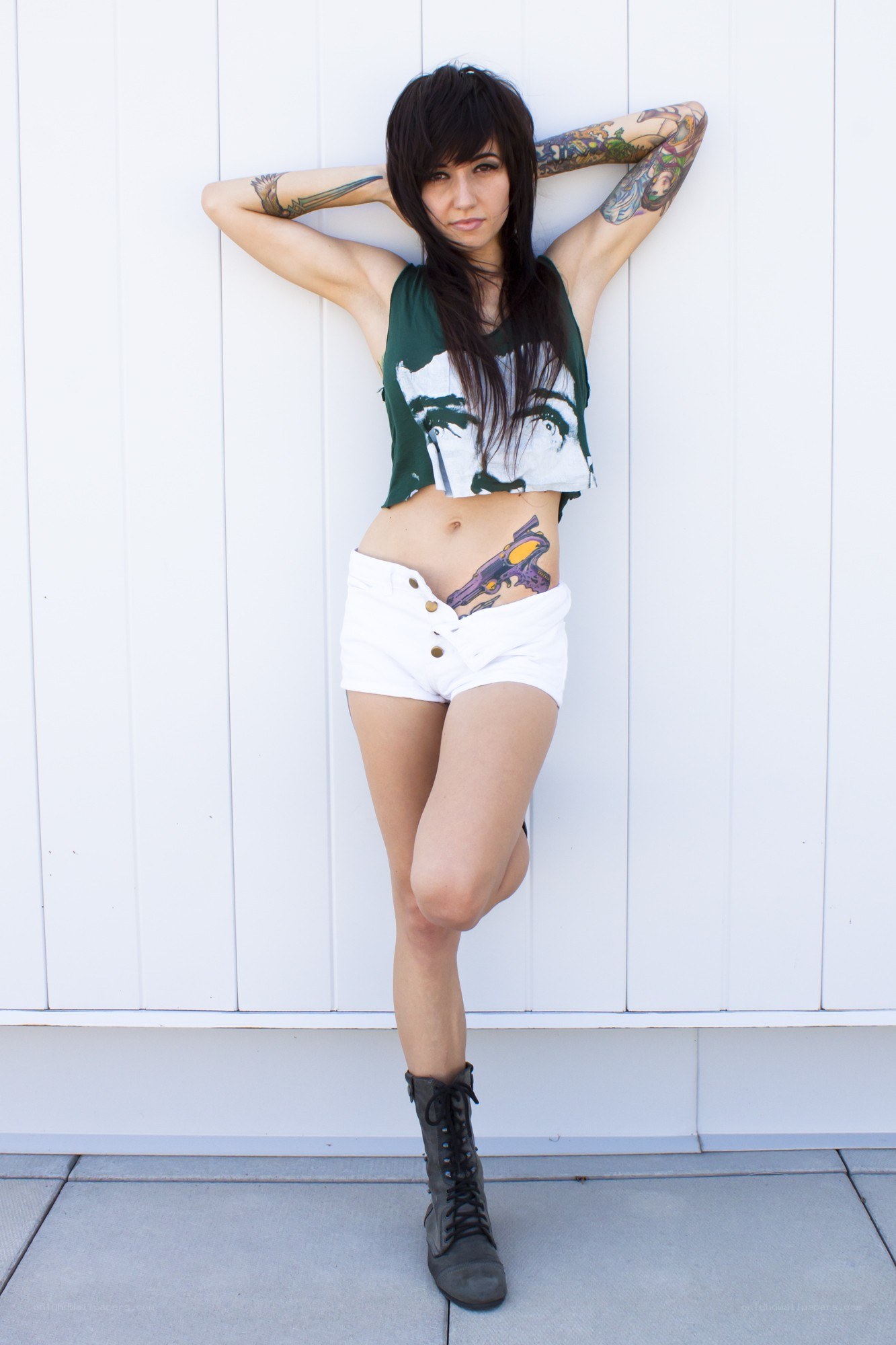 woman with tattoos posing