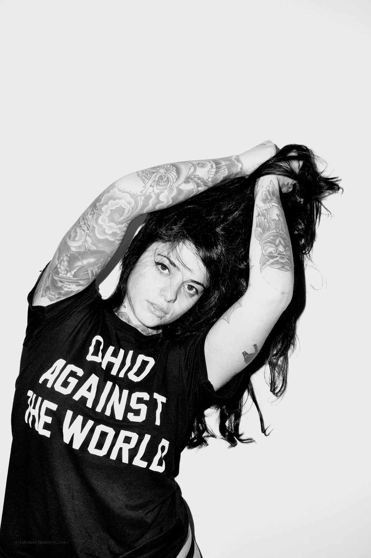 woman with tattoos posing