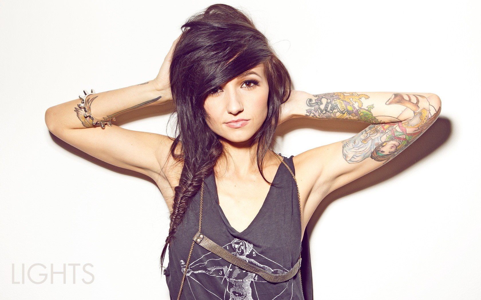woman with tattoos posing