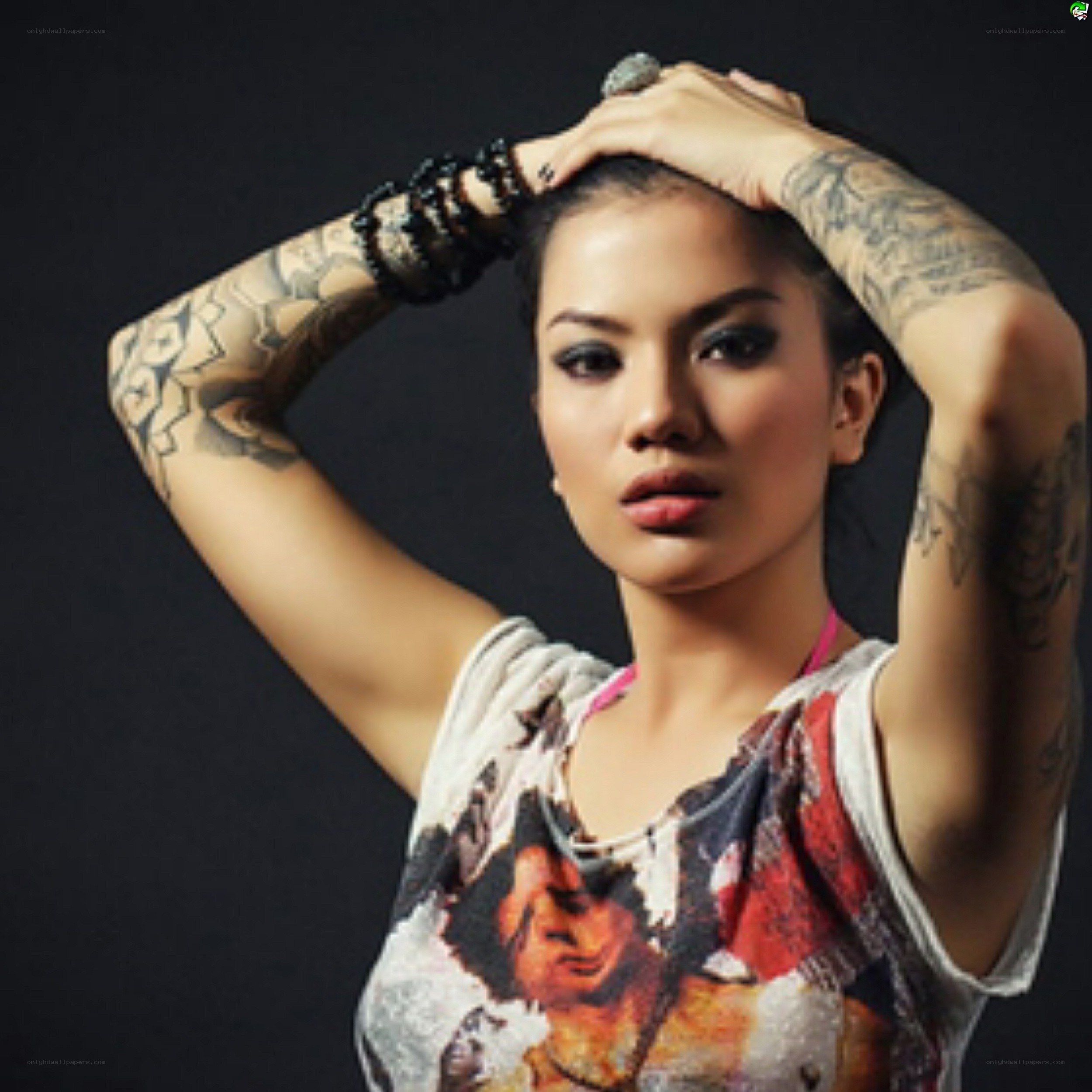 woman with tattoos posing