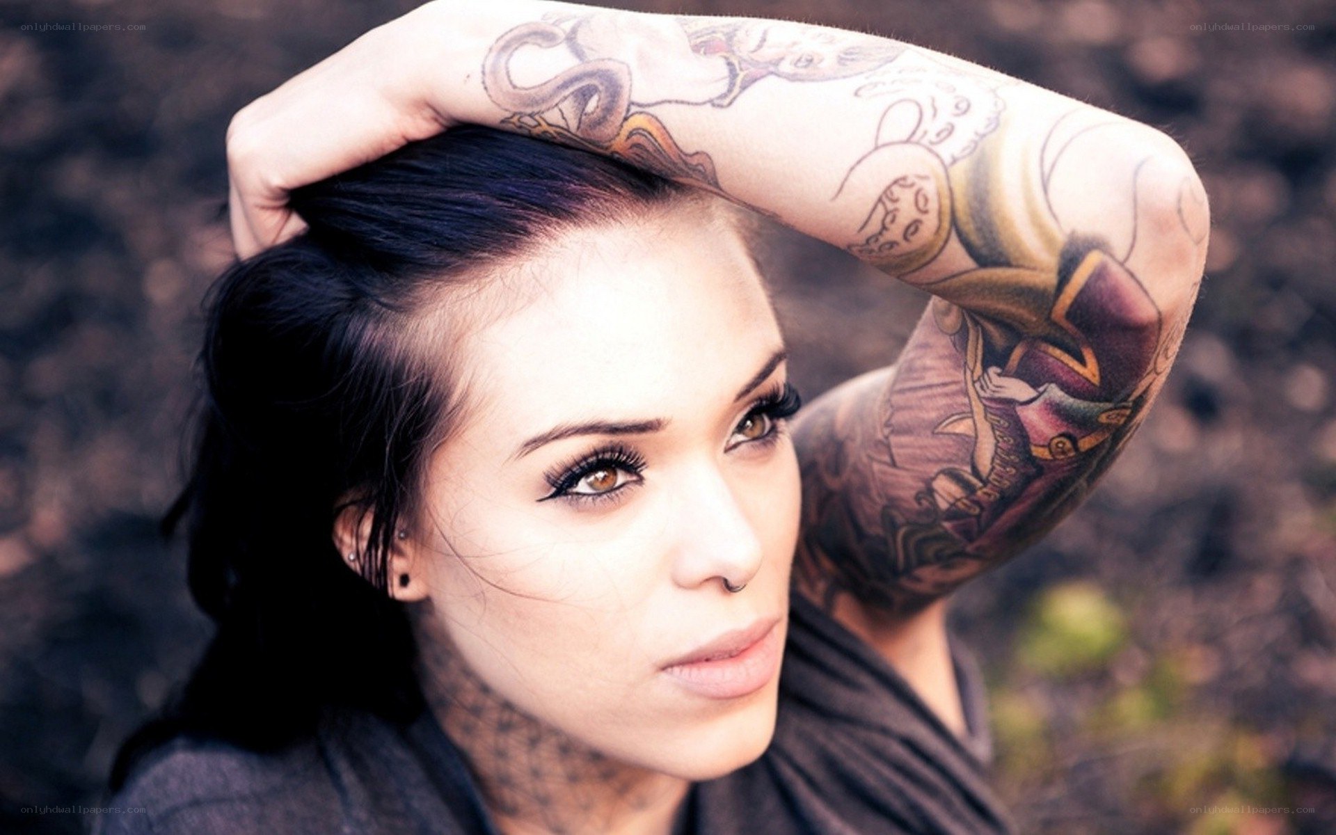 woman with tattoos posing
