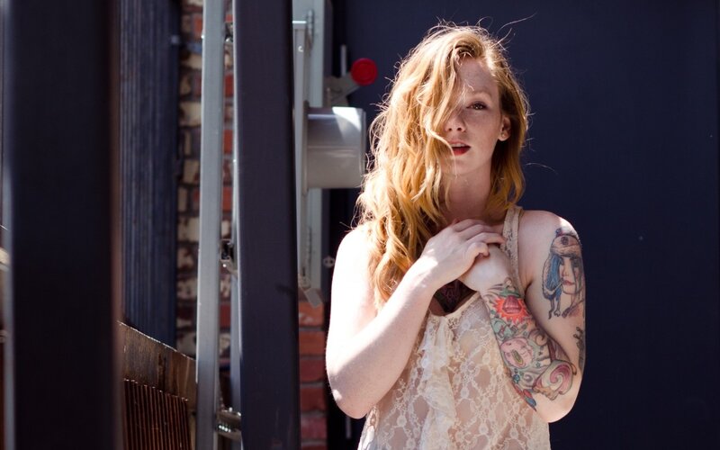 Woman with Tattoos — Red, Dramatic, Afternoon