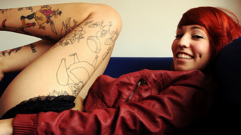 Woman with Tattoos — Red, Relaxed, Photograph