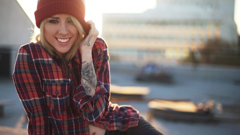 Woman with Tattoos — Red, Relaxed, Sunset