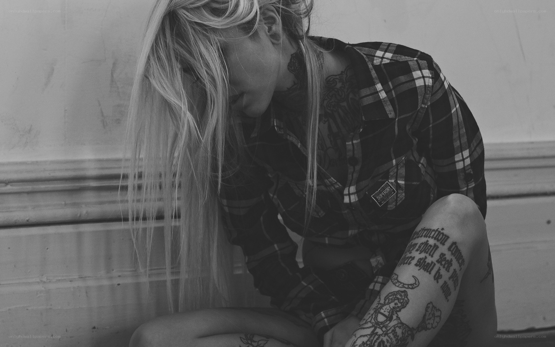woman with tattoos sitting