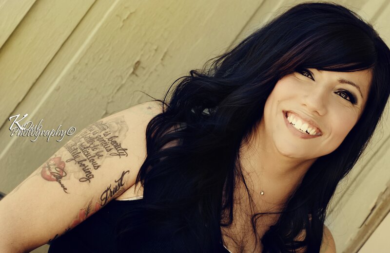 woman with tattoos smiling