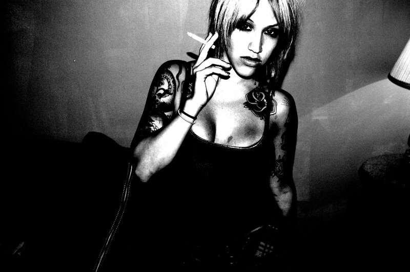 woman with tattoos smoking