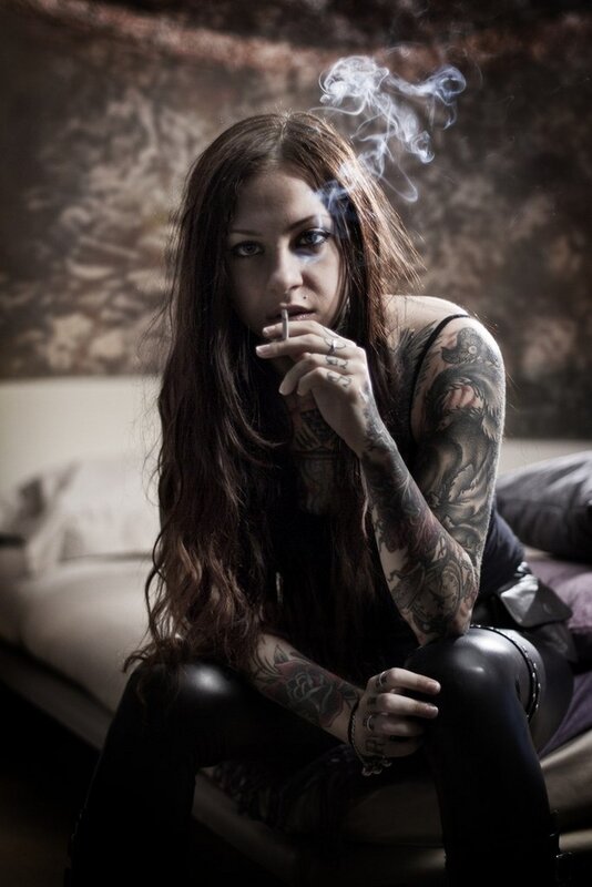 woman with tattoos smoking
