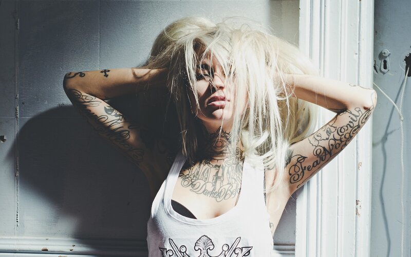 Woman with Tattoos — White, Dramatic, Photograph, Blonde Hair