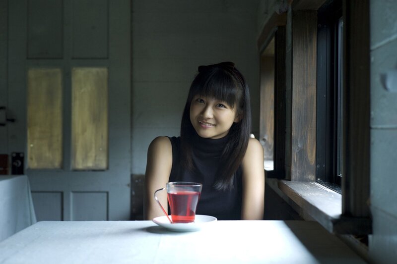 woman with tea by window