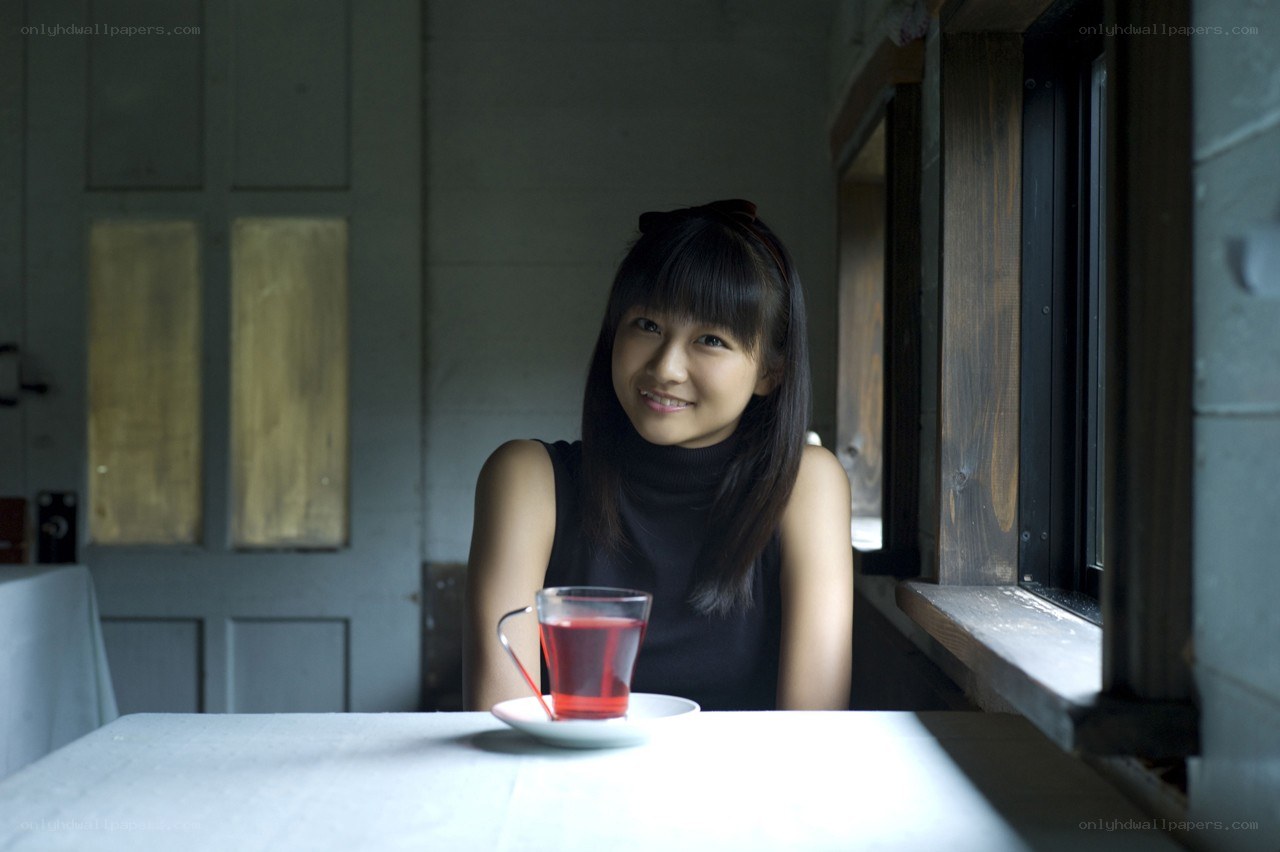 woman with tea by window