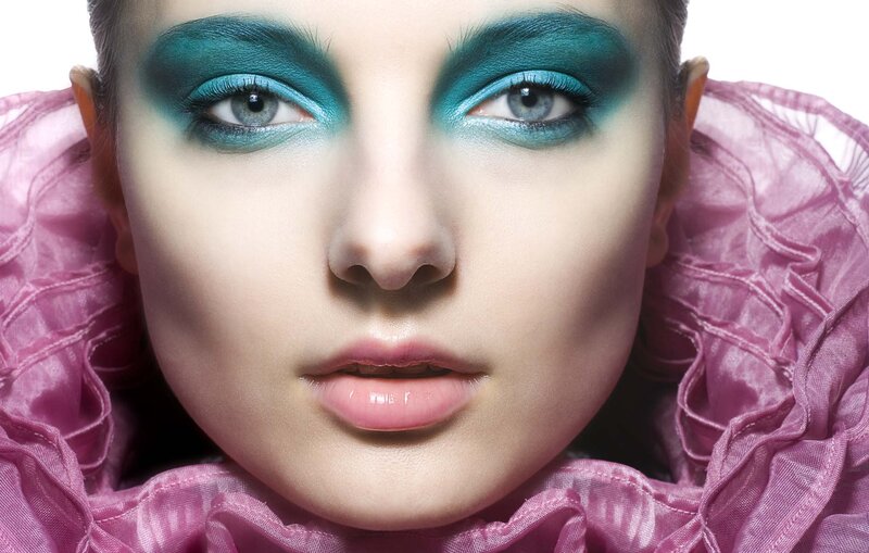 Woman with Teal Eye Makeup — Dramatic