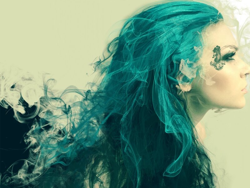 woman with teal hair and smoke