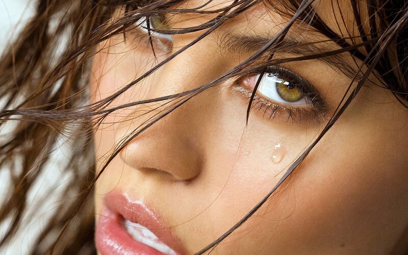 woman with tear in eye