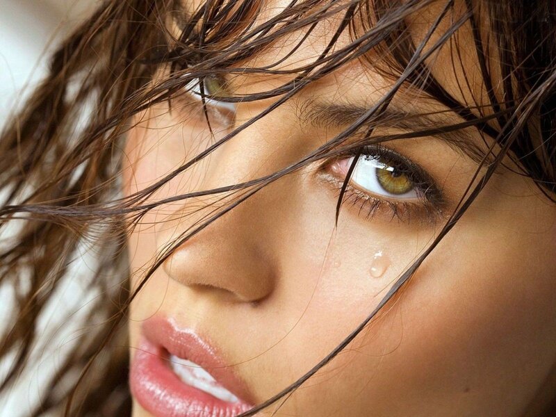 woman with tear in eye