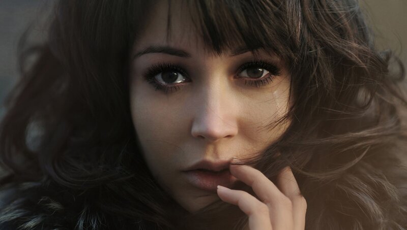 woman with tear in eye