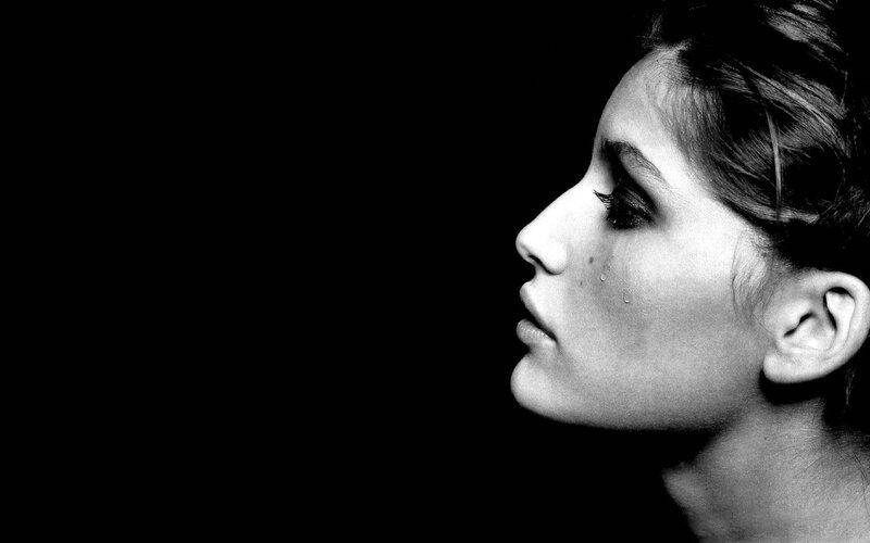 woman with tear in profile