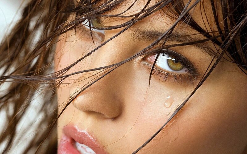woman with tear on cheek