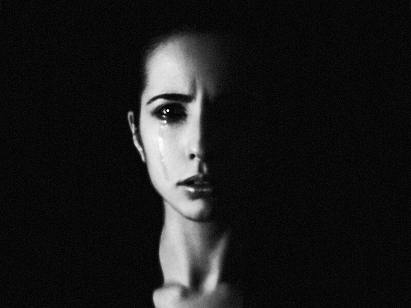 Woman with Tear on Face — Black