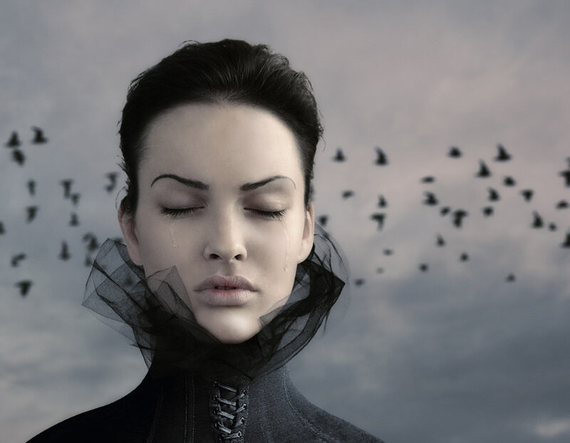 woman with tears and birds