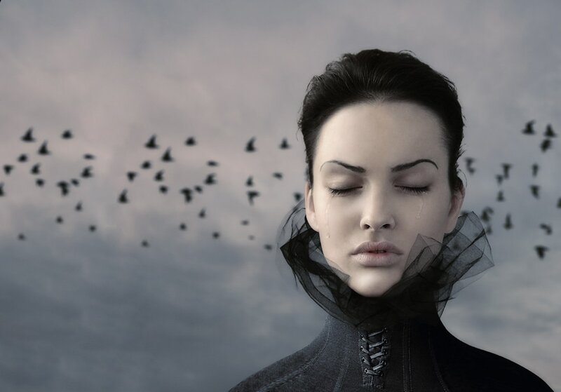 woman with tears and birds