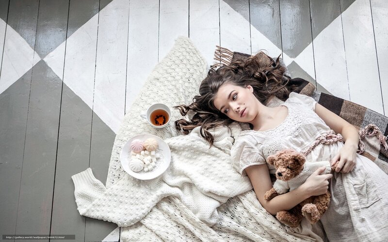 woman with teddy bear on floor