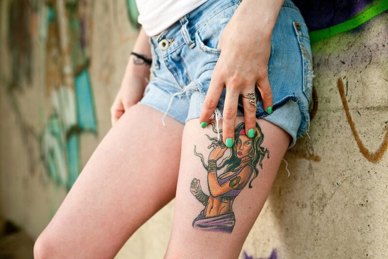 woman with thigh tattoo