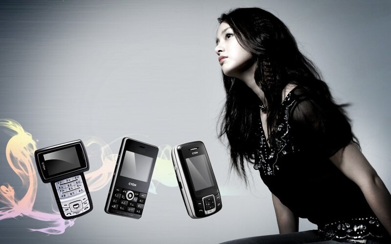 woman with three mobile phones