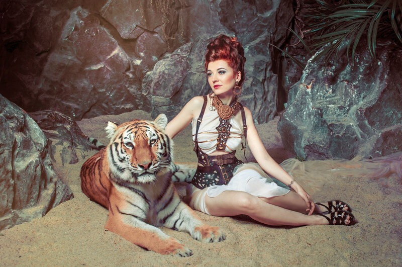 Woman with Tiger — Brown, Dramatic, Photograph, Rocks