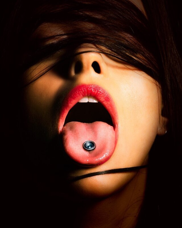 woman with tongue piercing