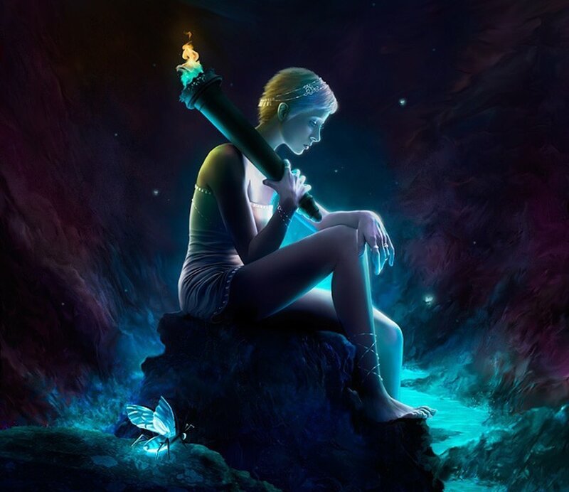 woman with torch in cave