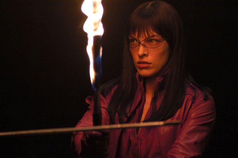 woman with torch in dark room