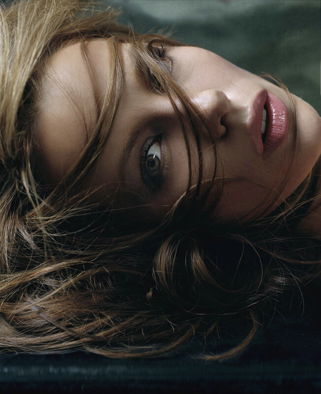 woman with tousled hair lying down