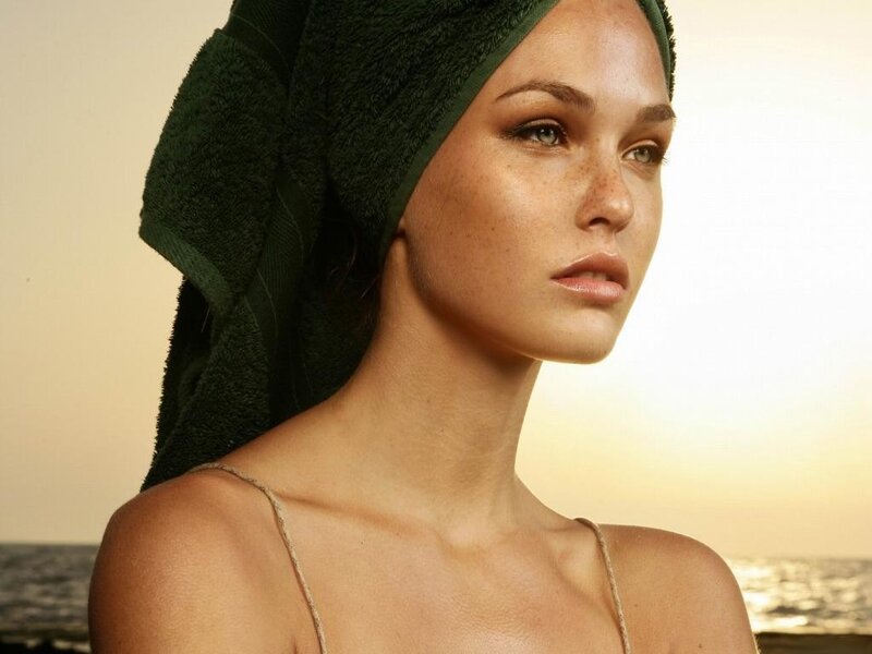 woman with towel at beach