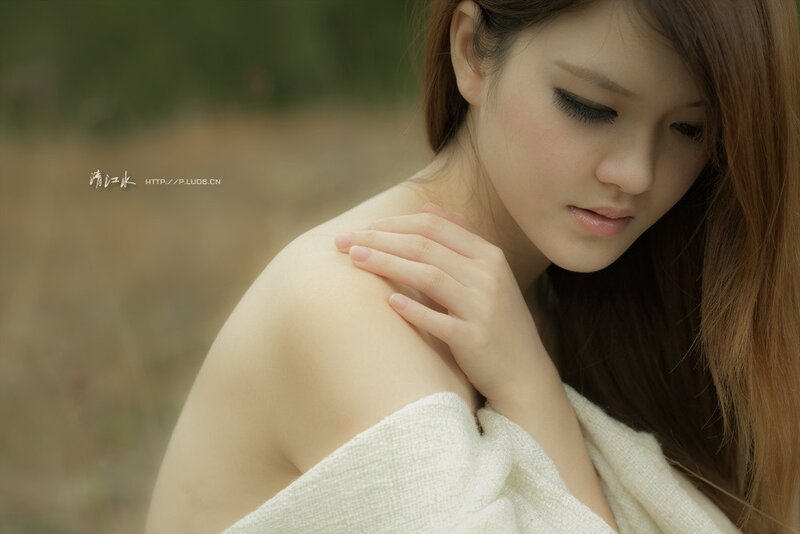 woman with towel on shoulder