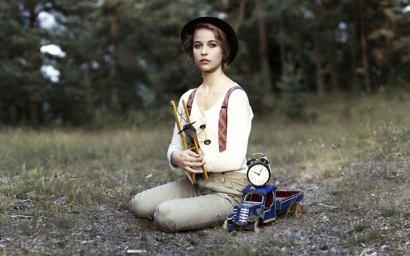 woman with toys in forest