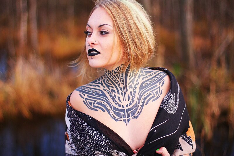 woman with tribal tattoos
