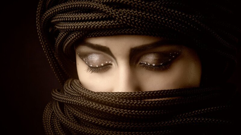 woman with turban and glitter makeup