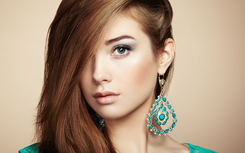 Woman with Turquoise Earrings — Brown