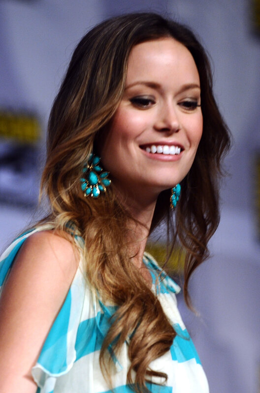 woman with turquoise earrings smiling