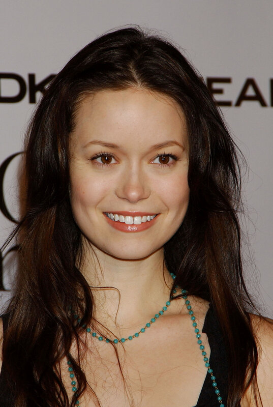 woman with turquoise necklace smiling