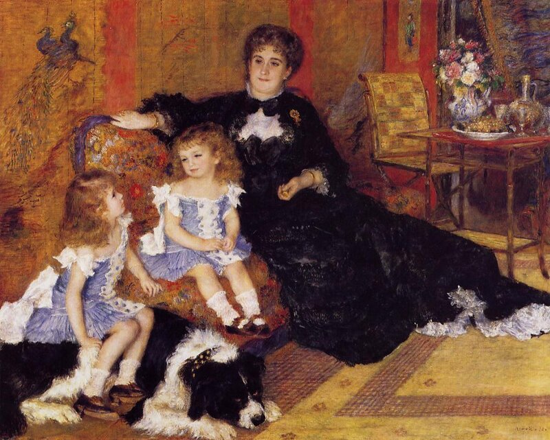 Woman with two children and a dog